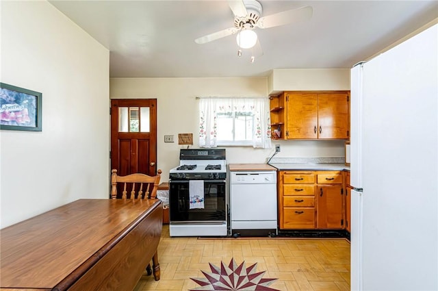 642 Washington St, Fairfield Twp, PA 15923 - kitchen with range with gas cooktop, white dishwasher, brown cabinets, open shelves, and a ceiling fan