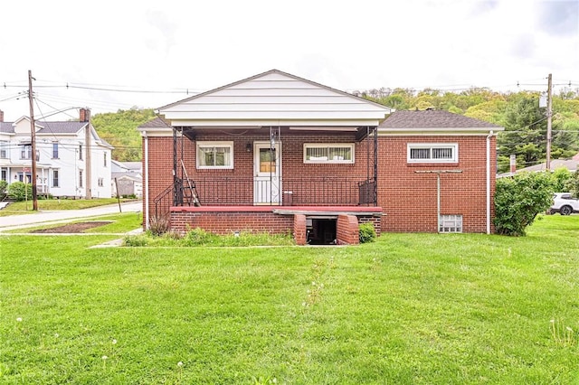642 Washington St, Fairfield Twp, PA 15923 - back of house with a yard, brick siding, and a porch