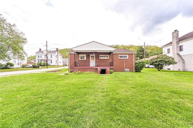 642 Washington St, Fairfield Twp, PA 15923 - back of property featuring covered porch, a lawn, and brick siding
