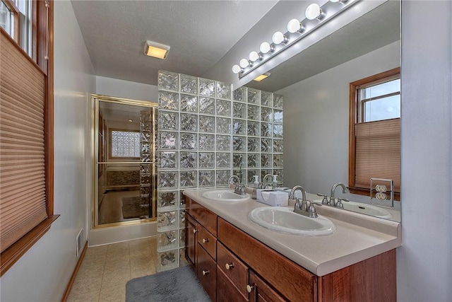 1057 Finchley Rd, North Huntingdon, PA 15642 - full bath featuring a stall shower, tile patterned floors, baseboards, and double vanity