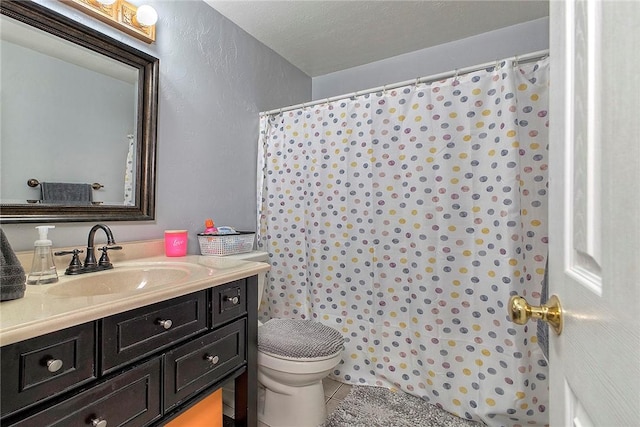 1057 Finchley Rd, North Huntingdon, PA 15642 - full bath featuring toilet, tile patterned floors, vanity, a textured wall, and a shower with shower curtain