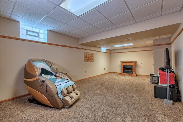 1057 Finchley Rd, North Huntingdon, PA 15642 - unfurnished room with carpet floors, a paneled ceiling, baseboards, and a fireplace with raised hearth