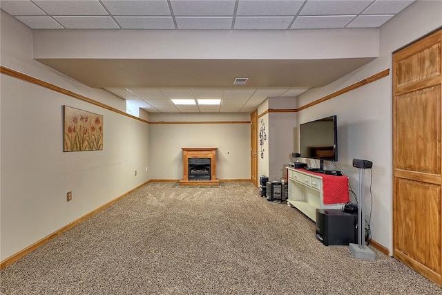 1057 Finchley Rd, North Huntingdon, PA 15642 - unfurnished living room featuring a paneled ceiling, carpet floors, a fireplace with raised hearth, and baseboards