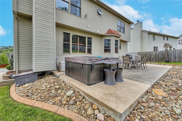 1057 Finchley Rd, North Huntingdon, PA 15642 - view of patio with a hot tub and fence