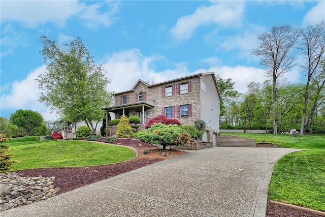 1057 Finchley Rd, North Huntingdon, PA 15642 - traditional-style house featuring driveway, an attached garage, and a front yard