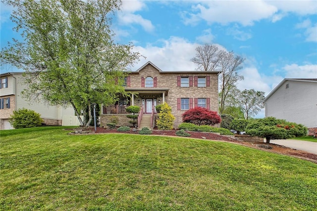 1057 Finchley Rd, North Huntingdon, PA 15642 - view of front of property with a front lawn and brick siding