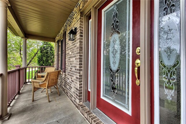 1057 Finchley Rd, North Huntingdon, PA 15642 - entrance to property with covered porch and brick siding