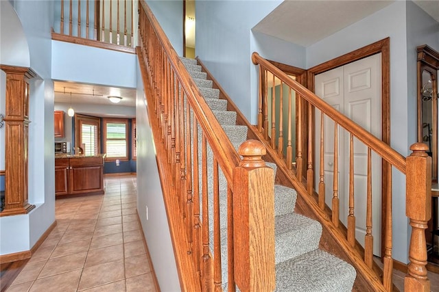 1057 Finchley Rd, North Huntingdon, PA 15642 - stairs with tile patterned flooring and baseboards