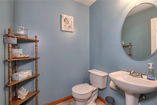1057 Finchley Rd, North Huntingdon, PA 15642 - bathroom featuring toilet and baseboards