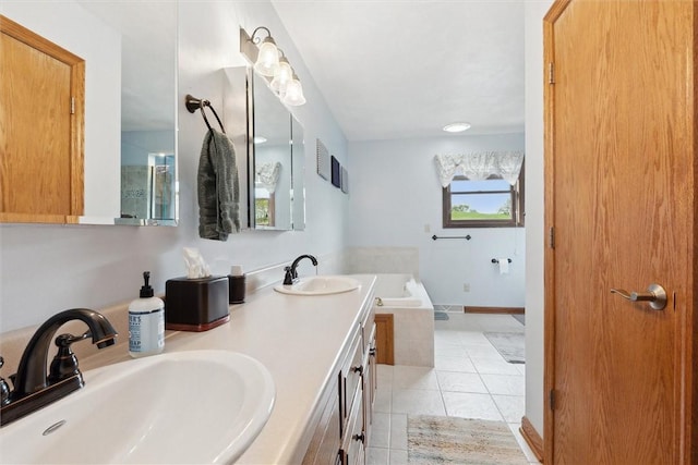 bathroom with tile patterned floors, a bath, and double vanity