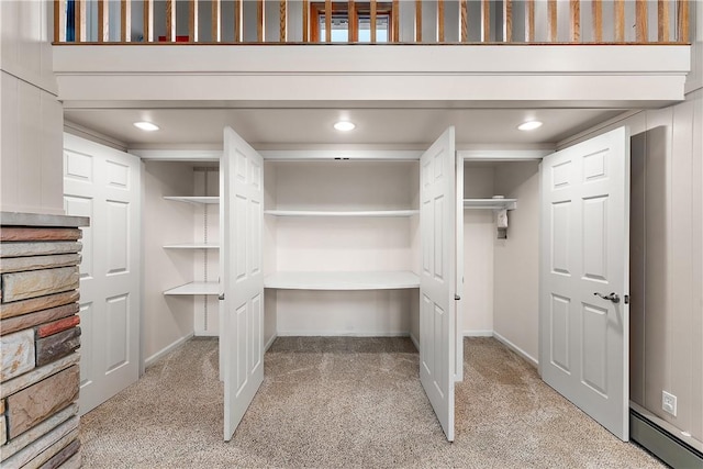 closet featuring baseboard heating