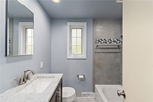 full bath with toilet, baseboards, and vanity
