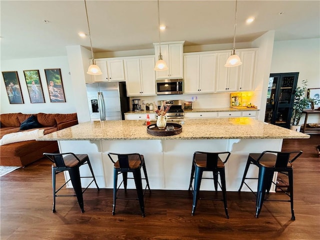159 Cole Dr, Robinson Twp Nwa, PA 15136 - kitchen with appliances with stainless steel finishes, white cabinetry, a breakfast bar area, a large island, and recessed lighting