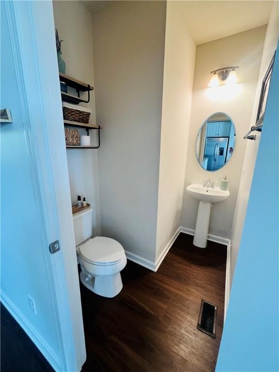 159 Cole Dr, Robinson Twp Nwa, PA 15136 - half bathroom with wood finished floors, toilet, baseboards, and a sink