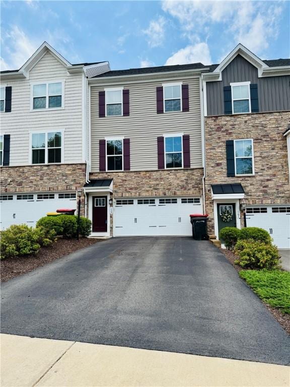 159 Cole Dr, Robinson Twp Nwa, PA 15136 - townhome / multi-family property with asphalt driveway, stone siding, an attached garage, and board and batten siding