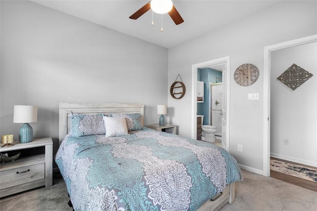 bedroom with carpet flooring, ensuite bath, baseboards, and ceiling fan