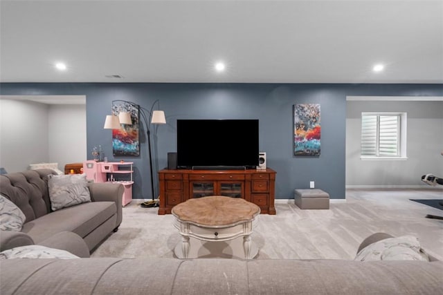 living room with carpet, recessed lighting, and baseboards