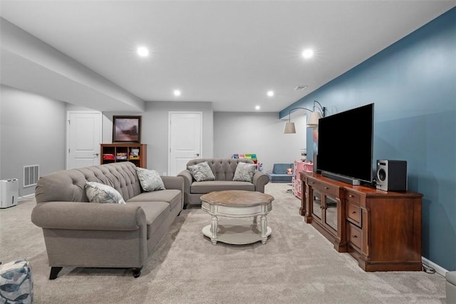 living area with light carpet, recessed lighting, and baseboards
