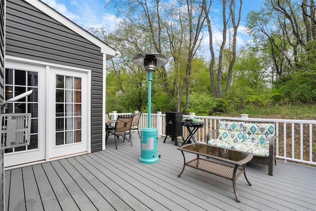deck with outdoor dining area