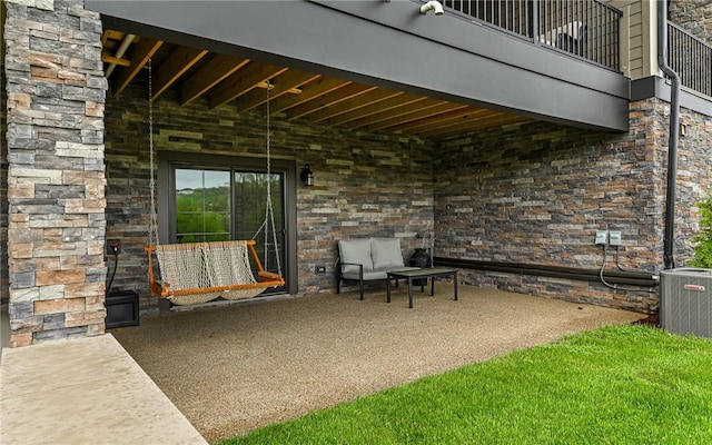 view of patio / terrace with a balcony and central AC unit