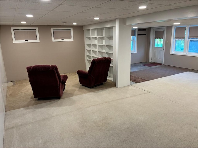 living area with carpet and recessed lighting