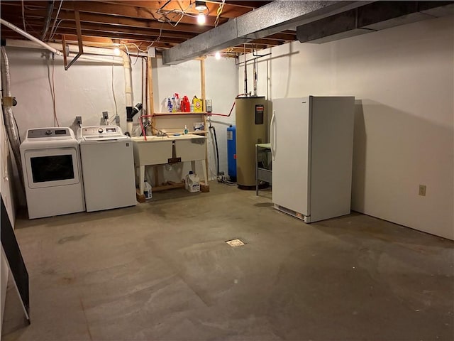 unfinished below grade area with water heater, freestanding refrigerator, and separate washer and dryer
