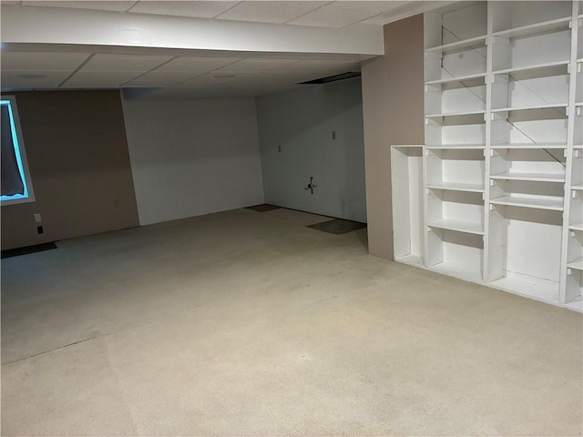 finished basement featuring light carpet