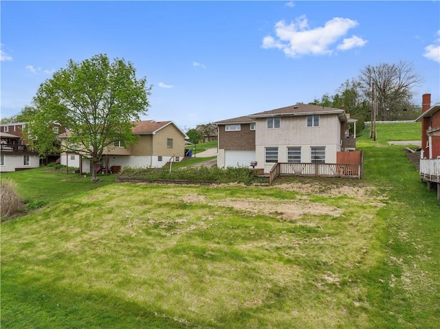 639 Scenery Dr, Elizabeth Twp/Boro, PA 15037 - back of property featuring an attached garage, a deck, and a lawn