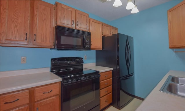 103 Hemlock Ct, Saxonburg Boro, PA 16056 - kitchen featuring black appliances, light countertops, and a sink