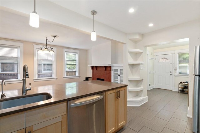 kitchen featuring dishwasher, a sink, dark countertops, built in shelves, and open shelves
