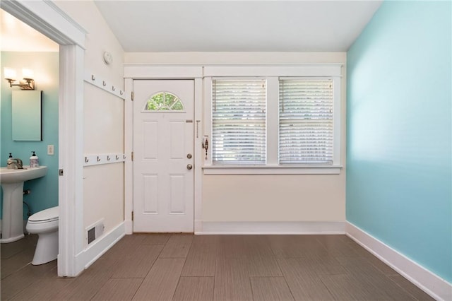 foyer entrance with baseboards