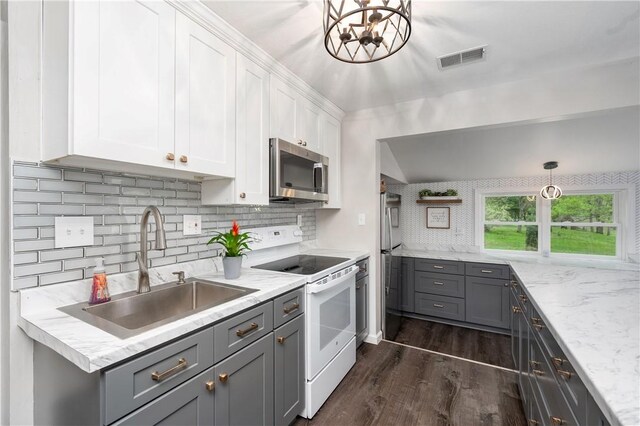 145 Robinson Pl, Perry Twp Arm, PA 16041 - kitchen featuring stainless steel microwave, white electric stove, a sink, and gray cabinetry