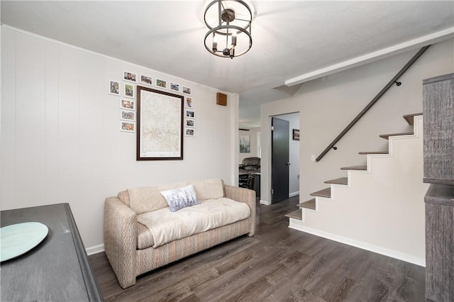living area featuring stairway, wood finished floors, and baseboards