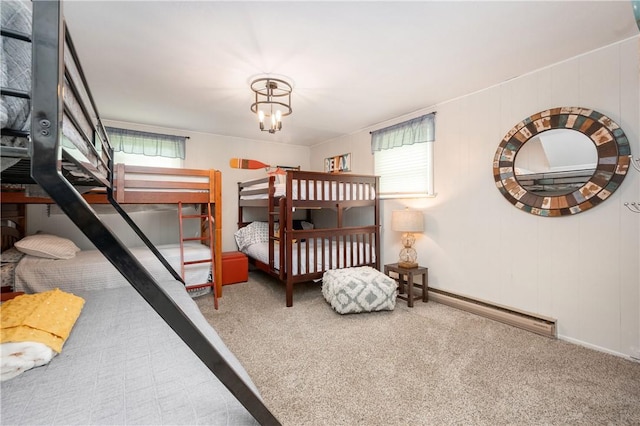 145 Robinson Pl, Perry Twp Arm, PA 16041 - carpeted bedroom with a baseboard radiator and a chandelier