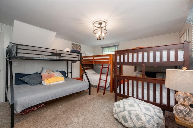 carpeted bedroom featuring a chandelier