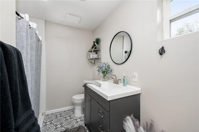 145 Robinson Pl, Perry Twp Arm, PA 16041 - full bath with vanity, toilet, tile patterned floors, baseboards, and a shower with curtain