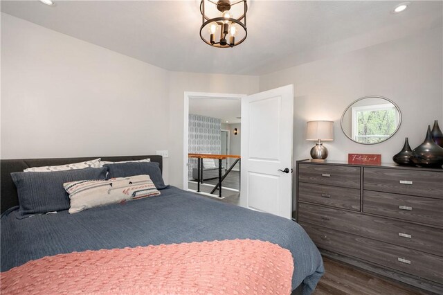 145 Robinson Pl, Perry Twp Arm, PA 16041 - bedroom with dark wood finished floors, recessed lighting, and a chandelier