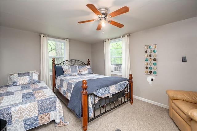 145 Robinson Pl, Perry Twp Arm, PA 16041 - bedroom with multiple windows, baseboards, light colored carpet, and ceiling fan