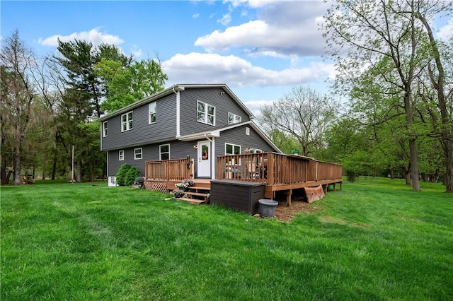 back of house with a yard and a deck