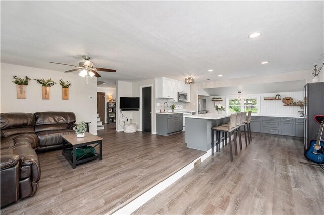 145 Robinson Pl, Perry Twp Arm, PA 16041 - living room featuring a ceiling fan, wood finished floors, and recessed lighting