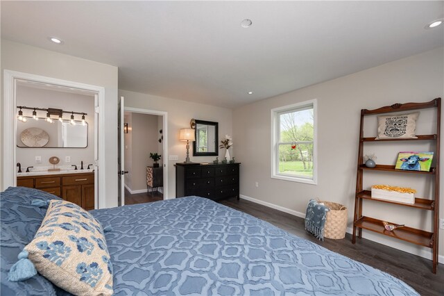 145 Robinson Pl, Perry Twp Arm, PA 16041 - bedroom with dark wood-style flooring, baseboards, a sink, ensuite bath, and recessed lighting