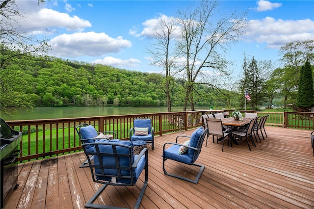 145 Robinson Pl, Perry Twp Arm, PA 16041 - deck with a water view, outdoor dining space, and a wooded view