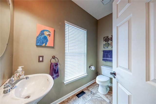 111 Cherrywood Dr, Plum Boro, PA 15068 - bathroom featuring a sink, baseboards, toilet, and healthy amount of natural light