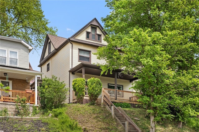 209 E Meyers St, Carrick, PA 15210 - back of property featuring covered porch and stairway