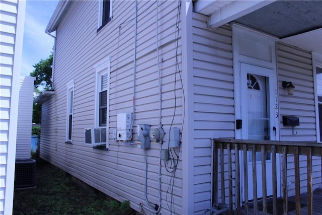 view of side of home featuring central AC