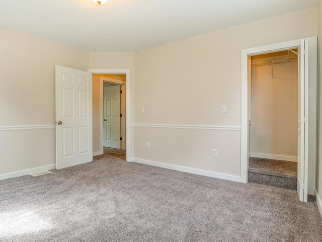 411 4th St, Darlington, PA 16115 - unfurnished bedroom featuring carpet floors, a spacious closet, a closet, and baseboards