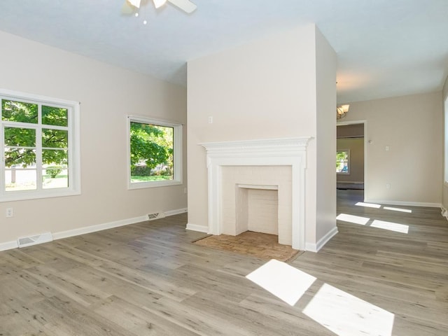 411 4th St, Darlington, PA 16115 - unfurnished living room with healthy amount of natural light, wood finished floors, a chandelier, and ceiling fan