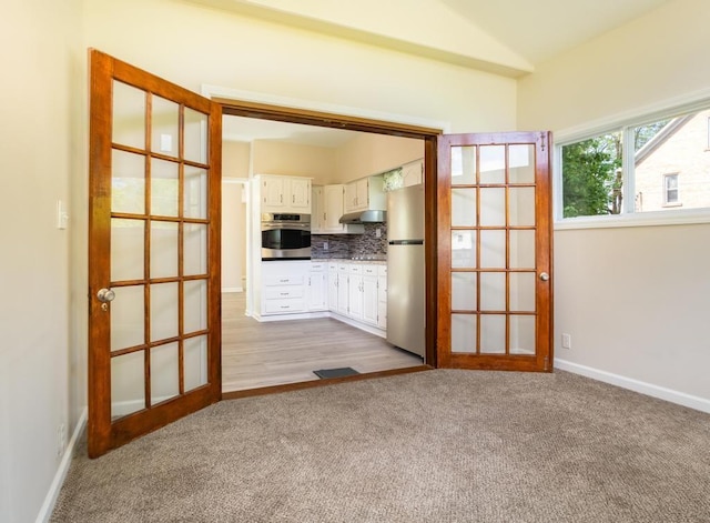 411 4th St, Darlington, PA 16115 - entryway with carpet flooring, french doors, vaulted ceiling, and baseboards