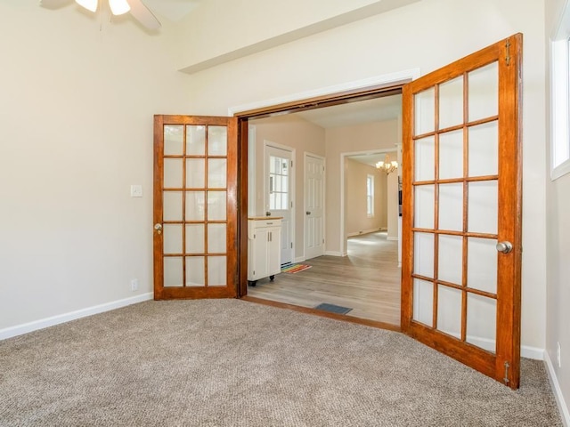 411 4th St, Darlington, PA 16115 - carpeted empty room with a chandelier, baseboards, and ceiling fan