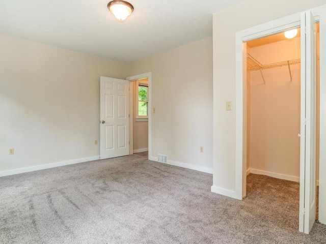 411 4th St, Darlington, PA 16115 - unfurnished bedroom with a spacious closet, carpet floors, a closet, and baseboards
